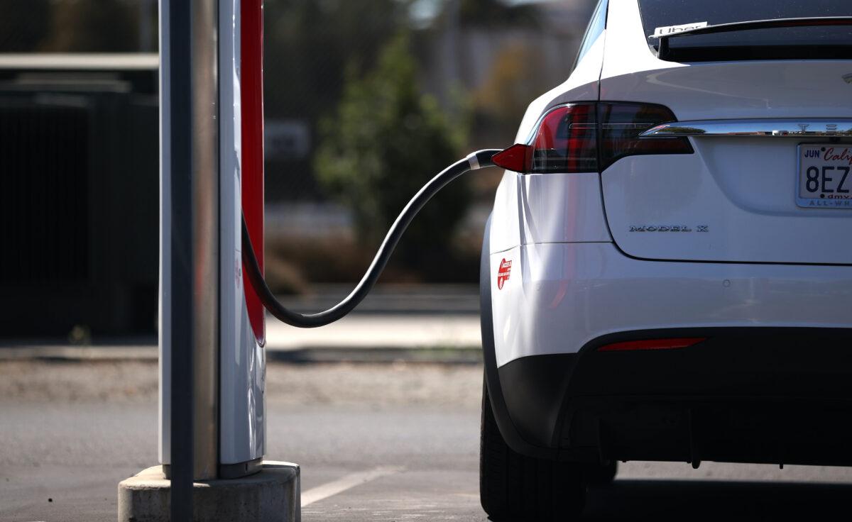 A Tesla car sits parked at a Tesla Supercharger in Petaluma, Calif., on Sept. 23, 2020. (Justin Sullivan/Getty Images)