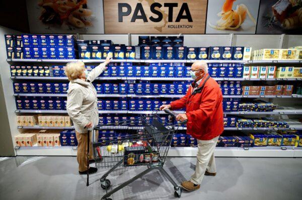 Customers at the Edeka grocery store buy pasta, as the spread of coronavirus disease (COVID-19) continues in Duesseldorf, Germany, on April 29, 2020. (Wolfgang Rattay/Global Business Week Ahead/Reuters)