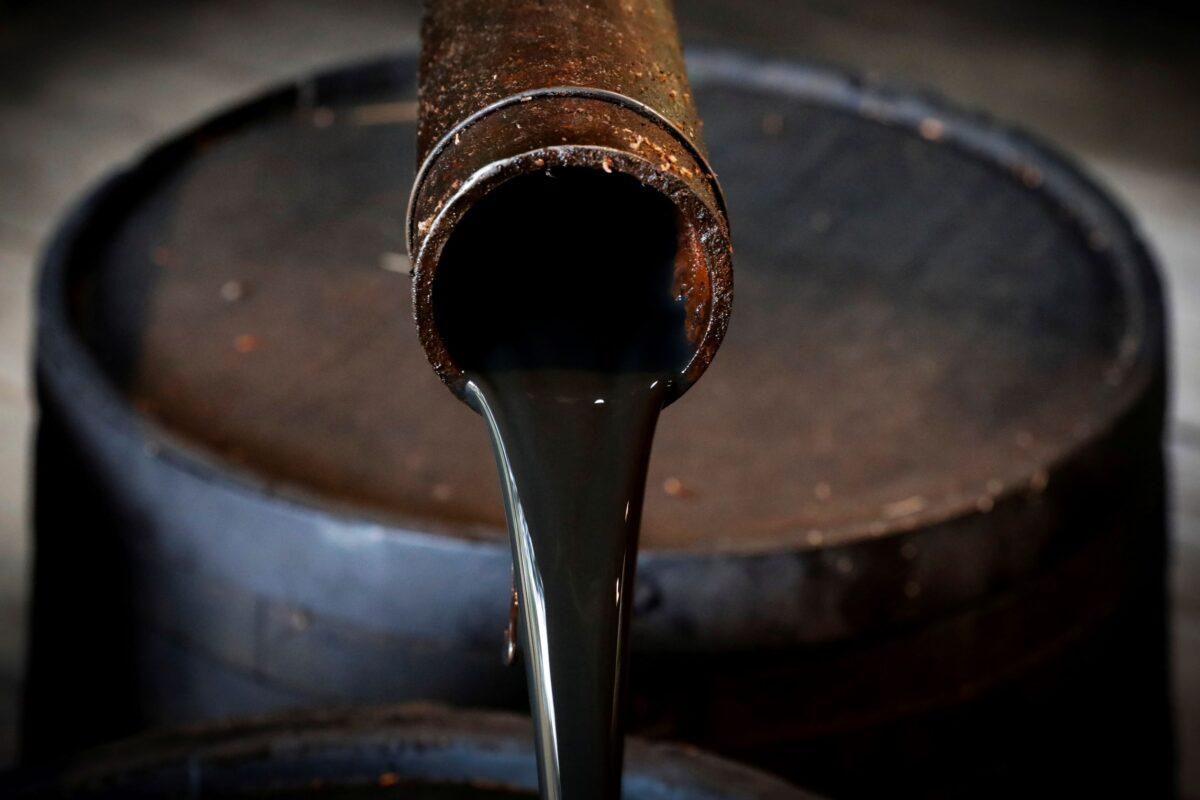 Oil pours out of a spout from Edwin Drake's original 1859 well that launched the modern petroleum industry at the Drake Well Museum and Park in Titusville, Pa., on Oct. 5, 2017. (Brendan McDermid/Reuters)