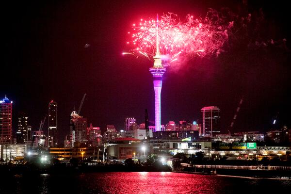 Fireworks explode over Sky Tower in central Auckland as New Year celebrations begin in New Zealand, on Jan. 1, 2023. (Dean Purcel/NZ Herald via AP)