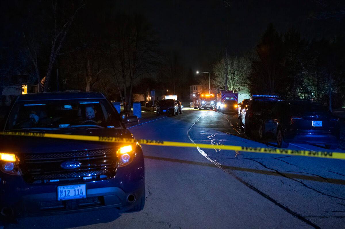 Buffalo Grove Police work the scene where multiple people were found dead inside a home in Buffalo Grove, Ill., on Nov. 30, 2022. (Tyler Pasciak LaRiviere/Chicago Sun-Times via AP)
