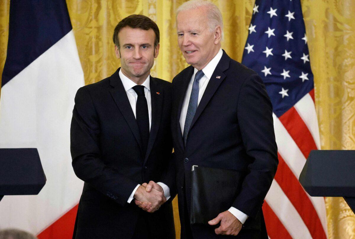 US President Joe Biden and French President Emmanuel Macron shake hands after a joint press conference in the East Room of the White House in Washington on Dec. 1, 2022. (Ludovic Marin/AFP via Getty Images)