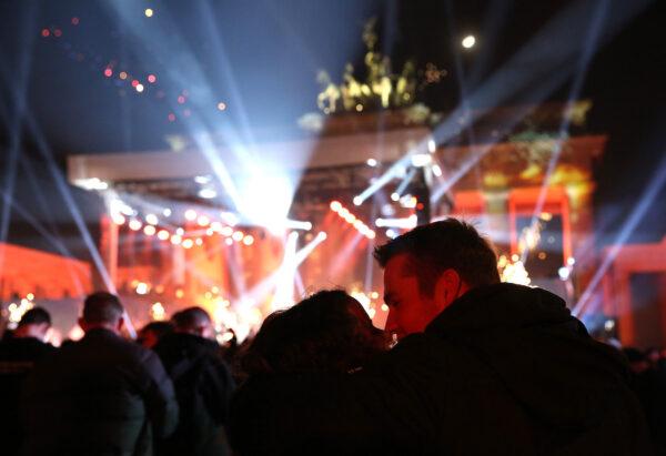 Visitors celebrate the new year at the Brandenburg Gate in Berlin, Germany, on Jan. 1, 2023. (Adam Berry/Getty Images)