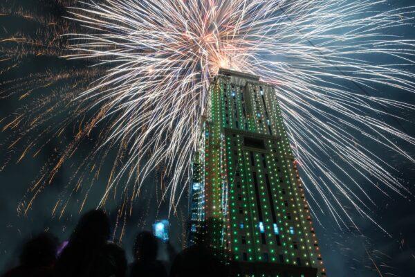 People look at fireworks launching from the building of Old Mutual Tower to celebrate the new year in Nairobi, Kenya, on Jan. 1, 2023. (Yasuyoshi Chiba/AFP via Getty Images)