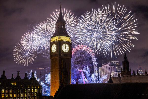 Fireworks light up the London skyline over Big Ben and the London Eye just after midnight in London, England, on Jan. 1, 2023. (Dan Kitwood/Getty Images)