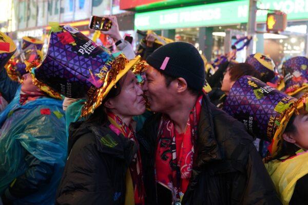A couple kisses at Times Square during New Year celebrations in New York City, on Jan. 1, 2023. (David Dee Delgado/Getty Images)