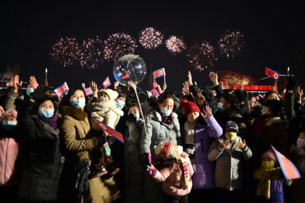 People attend a fireworks display ceremony during celebrations for the new year on Kim Il Sung Square in Pyongyang early on Jan. 1, 2023. (Kim Won Jin/AFP via Getty Images)