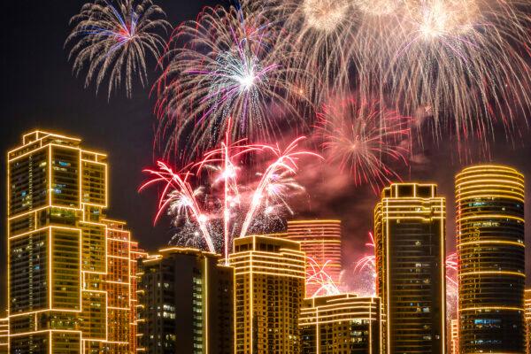 Fireworks explode over buildings during New Year's celebrations in Makati, Metro Manila, Philippines, on Jan. 1, 2023. (Ezra Acayan/Getty Images)