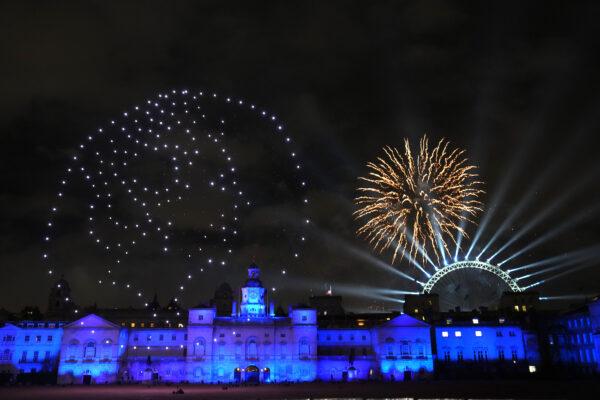 Fireworks and a drone show paying tribute to the late Queen Elizabeth II light up the London skyline to celebrate the New Year on in London, England, on Jan. 1, 2023. (Carl Court/Getty Images)