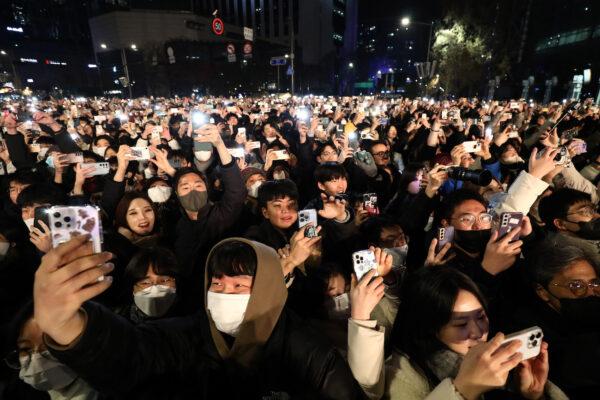 People gather to celebrate New Years during the annual bell-tolling ceremony at the Bosingak Pavilion in Seoul, South Korea, on Jan. 1, 2023. (Chung Sung-Jun/Getty Images)