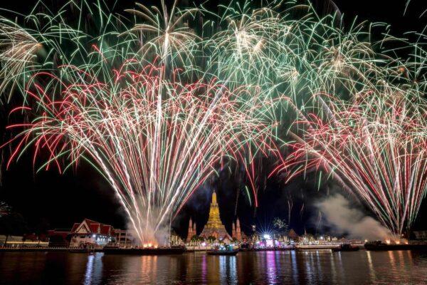 Fireworks show over Wat Arun Buddhist temple on the Chao Phraya River during New Year celebrations in Bangkok, Thailand, on Jan. 1, 2023. (Jack Taylor/AFP via Getty Images)