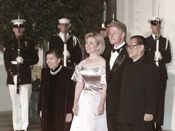 U.S. President Bill Clinton (2nd-R), First Lady Hillary Clinton (C), Chinese leader Jiang Zemin (R), and Jiang's wife Wang Yeping (L) pose for photographers on Oct. 29, 1997, upon Jiang's arrival at the White House for a state dinner in his honor. (Luke Frazza/AFP via Getty Images)