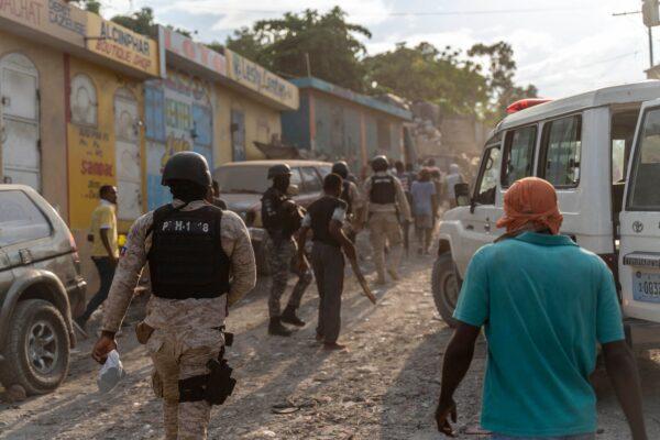 Police attempt to secure the area during an attack by armed gangs as people flee their homes in the Carrefour Feuille neighborhood of Port-au-Prince, Haiti, on Nov. 10, 2022. (Richard Pierrin/AFP via Getty Images)