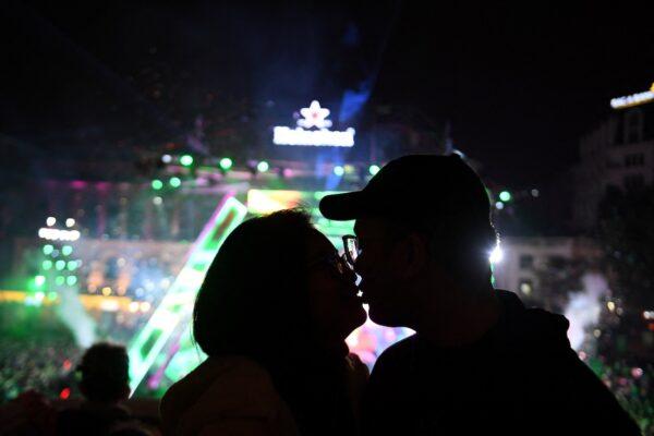 A couple kisses during the countdown to 2023 in Hanoi, Vietnam on Dec. 31, 2022. (Nhac Nguyen/AFP via Getty Images)