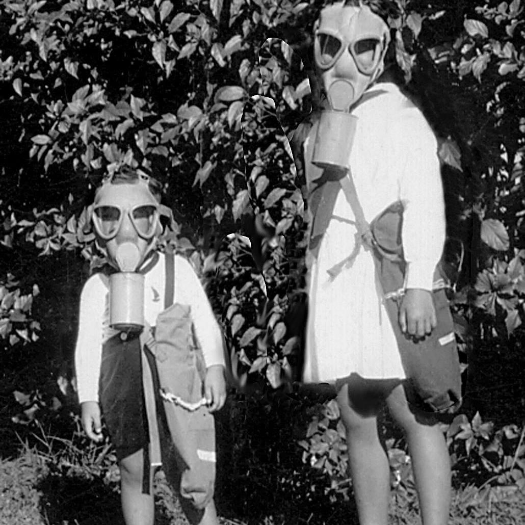 Dorinda Makanaonalani Nicholson and her brother obeying wartime rules to always carry their gas masks. (Courtesy of Dorinda Makanaonalani