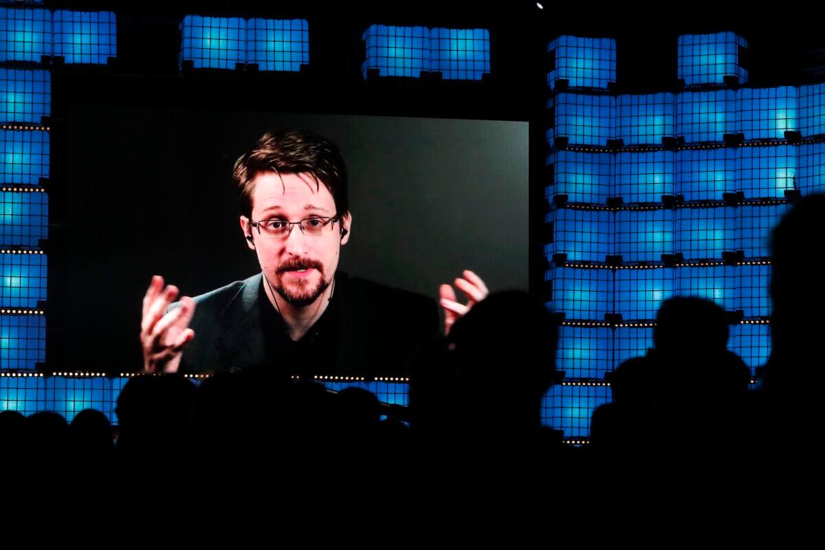Former U.S. National Security Agency contractor Edward Snowden speaks via video link at a tech conference in Lisbon, Portugal, on Nov. 4, 2019. (Armando Franca, File/AP Photo)