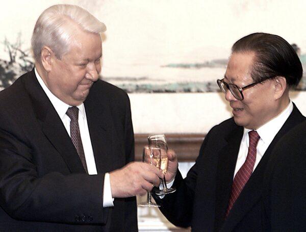 Russian President Boris Yeltsin (L) and Chinese leader Jiang Zemin toast each other after the signing of border agreements between the two countries, in Beijing on Dec. 9, 1999. (AFP via Getty Images)
