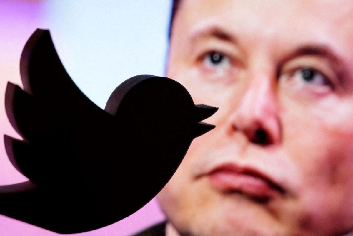 A 3D printed Twitter logo is seen in front of a displayed photo of Elon Musk in this illustration taken on Oct. 27, 2022. (Dado Ruvic/Illustration/Reuters)