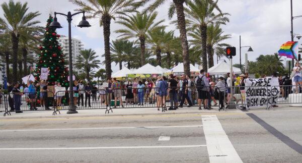 Group opposing the rally for Protect the Children gather to protest at Ft. Lauderdale Beach on Dec. 3, 2022. (Jann Falkenstern/The Epoch Times)