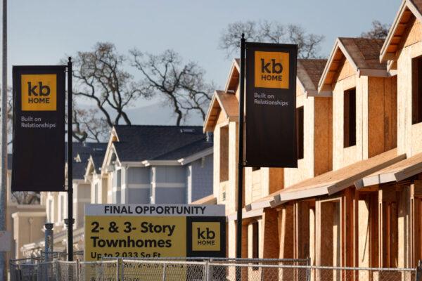 Signs are posted in front of homes under construction at a KB Home housing development in Novato, Calif., on Jan. 12, 2022. (Justin Sullivan/Getty Images)