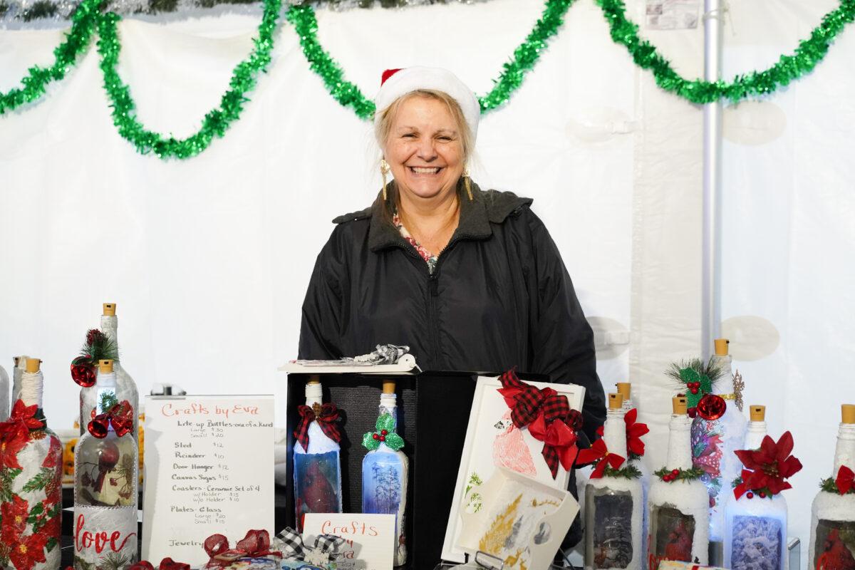 Eva Martin at her booth during the Christmas Market at New Century in Deerpark, N.Y., on Dec. 3, 2022. (Cara Ding/The Epoch Times)
