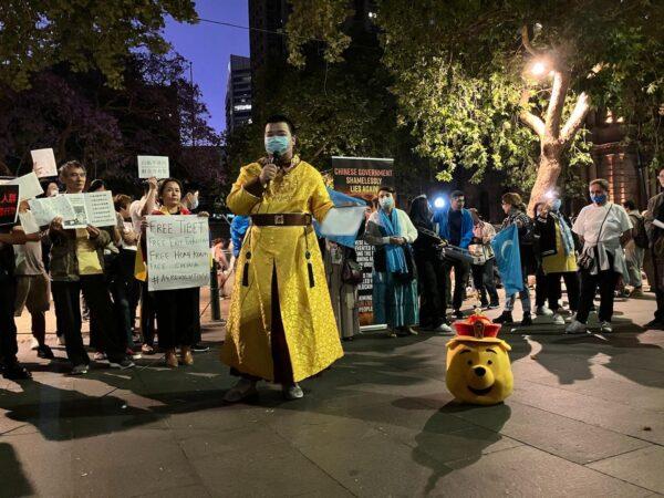 A Chinese student protester dressed as Winnie the Pooh, which is synonymous with Chinese leader Xi Jinping, at a rally in Sydney, Australia, in support of students risking their lives to protest COVID-19 restrictions in China on Dec. 3, 2022. (Melanie Sun/The Epoch Times)