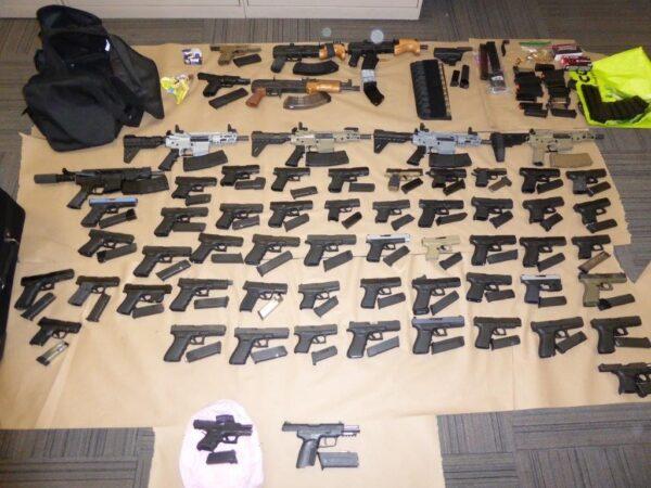 Toronto police announced on Dec. 5, 2022, that they had seized 62 illegal guns as part of an organized crime firearms trafficking bust. (Toronto Police Handout)