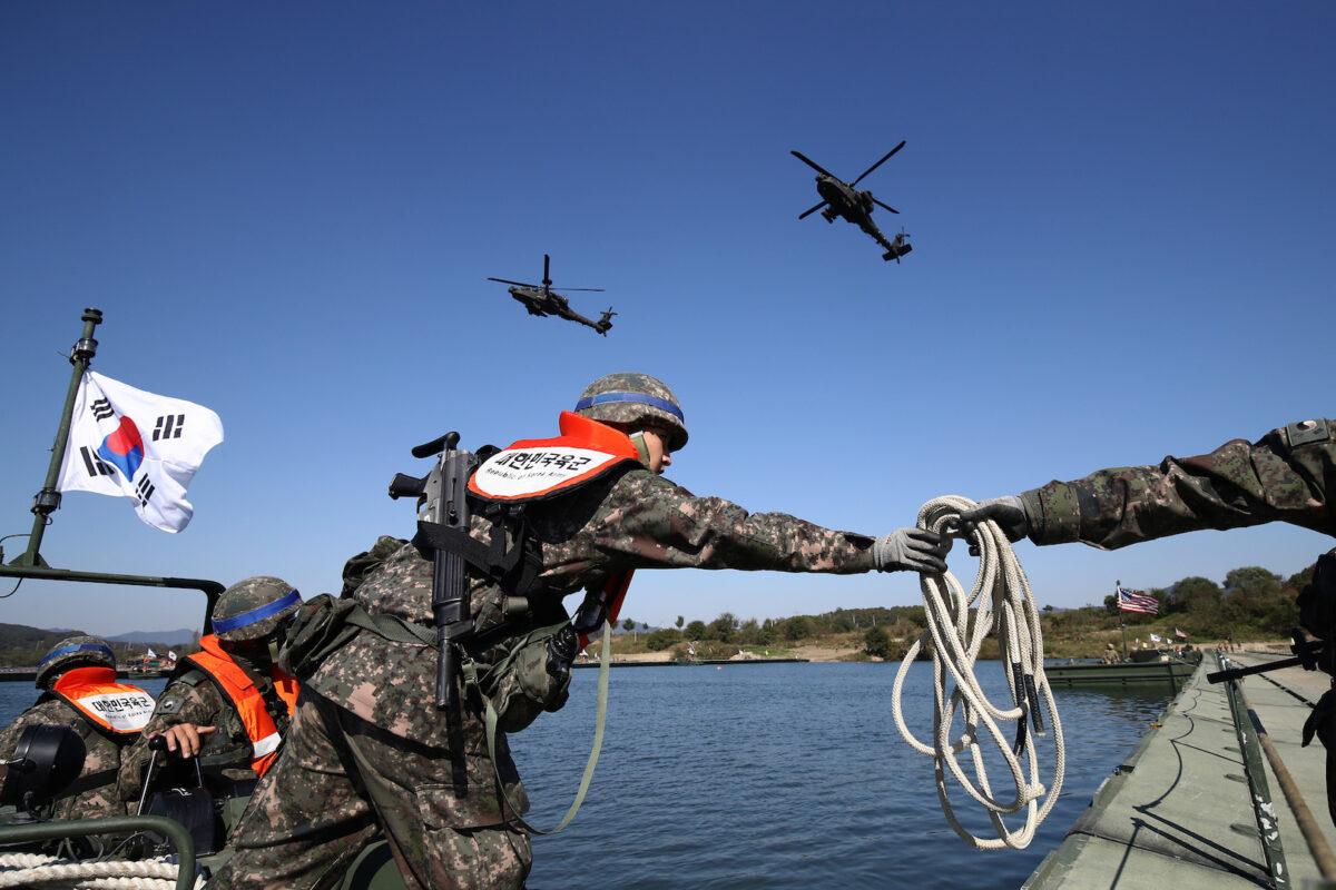 South Korean soldiers participate in a river crossing exercise with U.S. soldiers in Yeoju, South Korea, on Oct. 19, 2022. (Chung Sung-Jun/Getty Images)