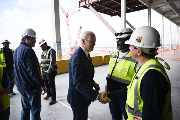 President Joe Biden (C) greets workers as he tours the TSMC Semiconductor Manufacturing Facility in Phoenix, Arizona, on Dec. 6, 2022. (Brendan Smialowski/AFP via Getty Images)