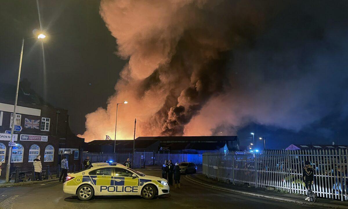 Handout photo from the twitter account @nathanfletch_ of firefighters attending a major incident at a derelict factory at Lower Horseley Fields, Wolverhampton, England, on Dec. 5, 2022. (Nathan Fletcher/Handout via PA Media)
