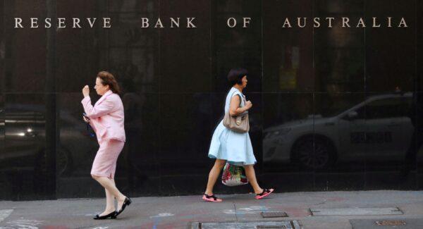 Two women walk next to the Reserve Bank of Australia headquarters in central Sydney, Australia, on Feb. 6, 2018. (Daniel Munoz/Reuters)