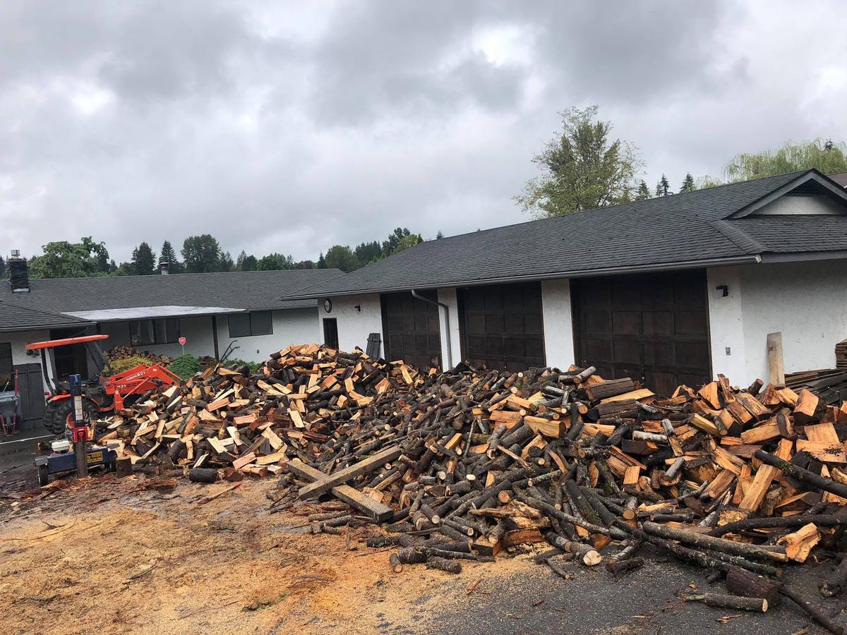 Piles of wood the McDaniels will split and deliver to veterans, the sick, or people down on their luck. (Courtesy of Shane McDaniel)