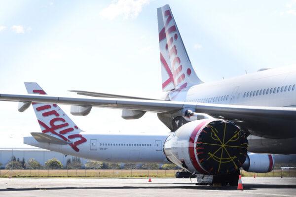 Virgin Australia wide-body aircrafts are seen parked in the Brisbane Airport in Brisbane, Australia, on Aug. 5, 2020. (Albert Perez/Getty Images)