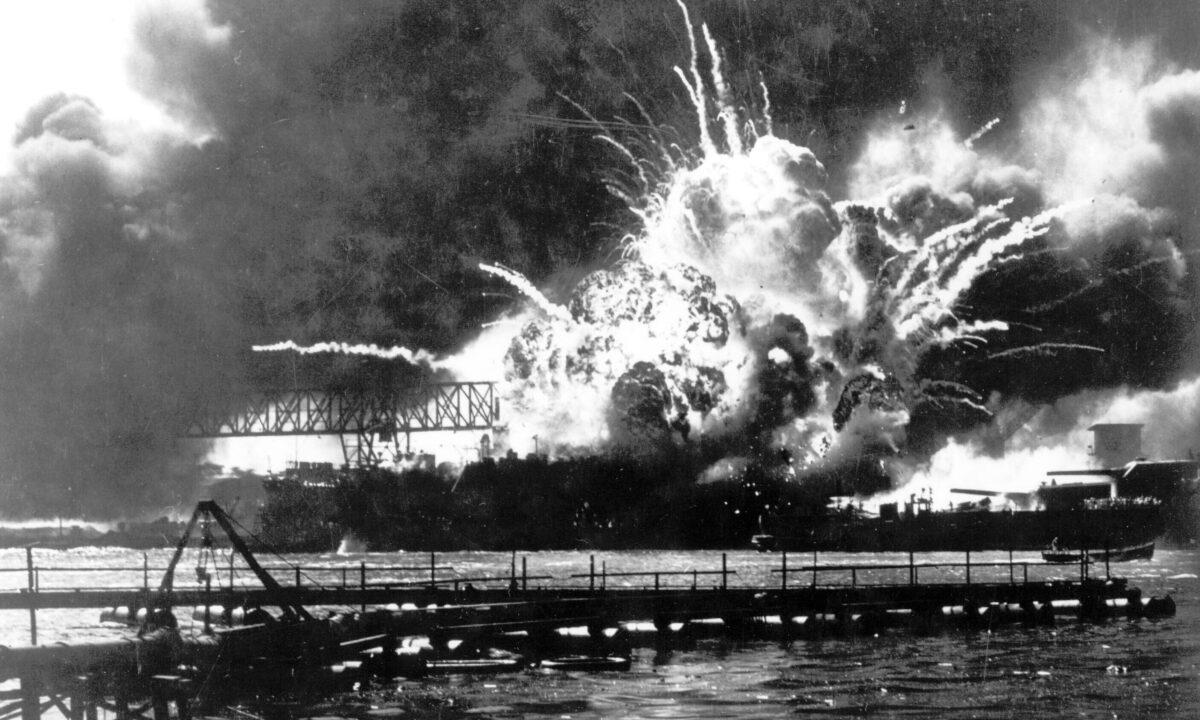 The destroyer USS Shaw explodes after being hit by bombs during the Japanese surprise attack on Pearl Harbor, Hawaii, on Dec. 7, 1941. (U.S. Navy via AP)