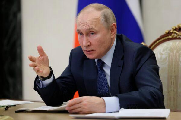 Russian President Vladimir Putin gestures while speaking during the annual meeting of the Presidential Council for Civil Society and Human Rights via videoconference in Moscow, on Dec. 7, 2022. (Mikhail Metzel, Sputnik, Kremlin Pool Photo via AP)