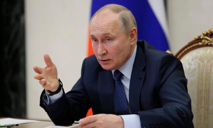 Russian President Vladimir Putin gestures while speaking via videoconference in Moscow on Dec. 7, 2022. (Mikhail Metzel, Sputnik, Kremlin Pool Photo via AP)