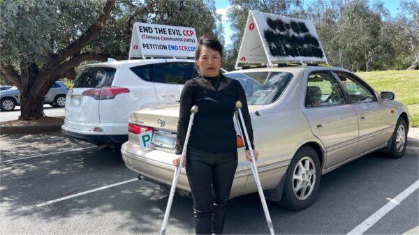 Nancy Dong was assaulted while protesting against the Chinese Communist Party in Canberra on Oct. 4, 2022. (Song Hua/The Epoch Times)