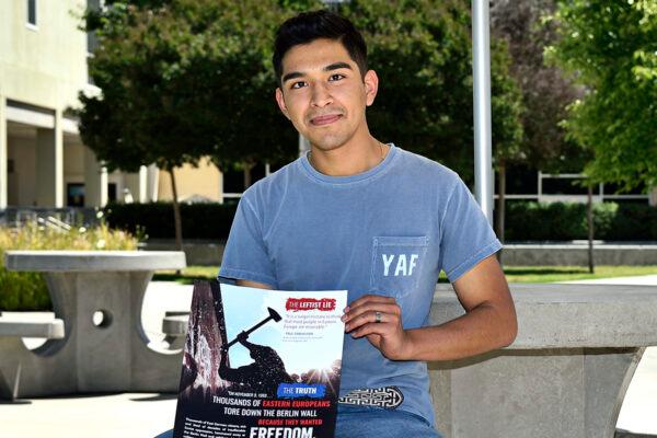 Student and plaintiff Alejandro Flores holds a flyer. (Courtesy of Alvarez Photography Studio)