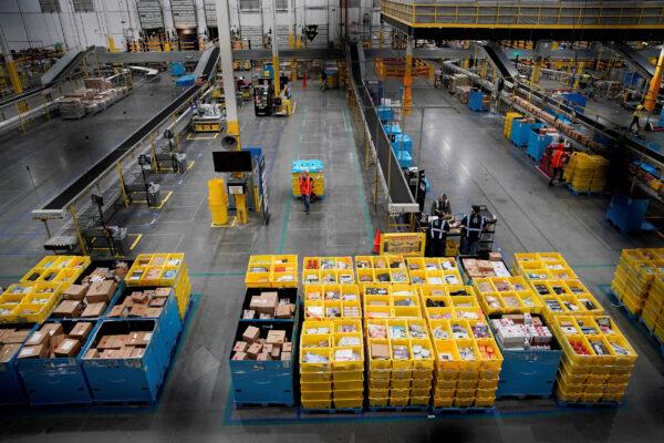 Workers select and pack items during Cyber Monday at the Amazon fulfillment center in Robbinsville Township, N.J., on Nov. 28, 2022. (Eduardo Munoz/Reuters)