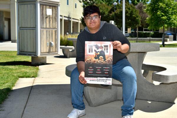 Student and plaintiff Daniel Flores holds a flyer. (Courtesy of Alvarez Photography Studio)
