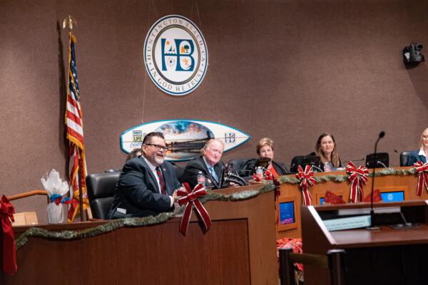 (L–R) Outgoing Councilman Erik Peterson, Mayor Pro Tem Mike Posey, Mayor Barbara Delgleize, and Councilwoman Kim Carr give exiting speeches, thanking the public for their time in office in Huntington Beach, Calif., on Dec. 6, 2022. (Julianne Foster/The Epoch Times)