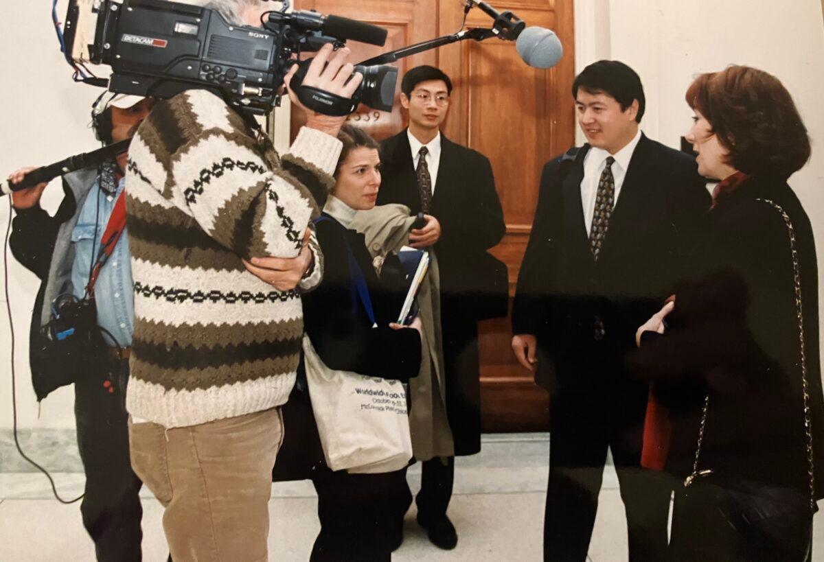 Falun Gong spokespersons Gail Rachlin (R) and Erping Zhang (2nd R) in Congress in 1999. (Courtesy of Gail Rachlin)