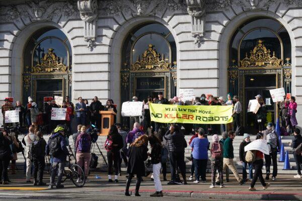 People take part in a demonstration about the use of robots by the San Francisco Police Department outside of City Hall in San Francisco, on Dec. 5, 2022. (Jeff Chiu/AP Photo)