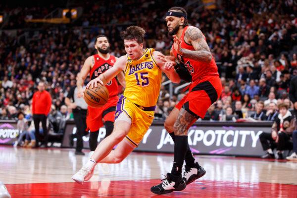 Austin Reaves (15) of the Los Angeles Lakers drives to the net against Gary Trent Jr. (33) of the Toronto Raptors during the second half of their NBA game at Scotiabank Arena in Toronto, Canada, on Dec. 7, 2022. (Cole Burston/Getty Images)
