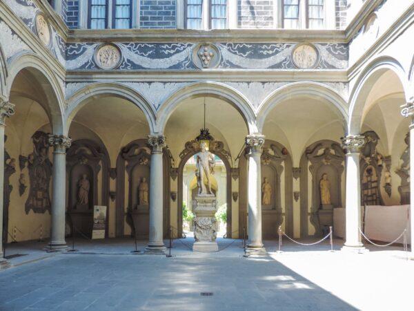 As soon as the visitors pass the doors of the Medici Riccardi Palace, they're greeted with an elegant inner courtyard featuring prominent classical features. An internal court surrounded by an arcade is typical of Renaissance palaces, and the Medici Palace is an early example of this.  On the arcade is the Medici crest, five red balls and a blue ball, which shows their influence on the Florentine Renaissance. Underneath the arcade windows, the friezes present sculptured marble medallions. (<a href="https://www.shutterstock.com/g/Bernard_Barroso">Bernard Barroso</a>/<a href="https://www.shutterstock.com/image-photo/florence-italy-june-2017-internal-view-1148800457">Shutterstock</a>)