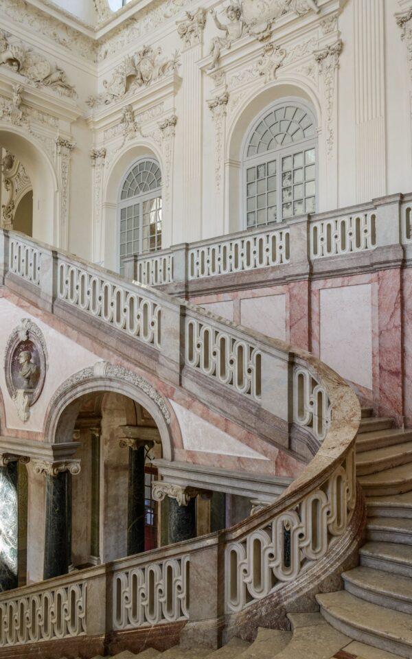 This magnificent staircase hall is one of the most impressive features in the New Palace. Covered in marble and stucco work by Bavarian artist Cosmas Damian Asam, it's a marvel of Baroque architecture. Henrico Zuccalli’s arrangement of the flight of stairs within a wide hall became standard in Germany from then on. (<a href="https://www.shutterstock.com/g/AESphoto">Andrey Shcherbukhi</a>/<a style="font-size: 16px;" href="https://www.shutterstock.com/image-photo/munich-germany-05-may-2016-luxury-449730157">Shutterstock)</a>
