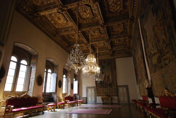 A glimpse of the Medici Riccardi Palace’s decoration after the Riccardi family renovated the interiors. This room is in the Baroque style, as shown by the beautiful gilded ceiling, hanging chandeliers, and furniture. However, the tapestries on the walls are a feature of the Renaissance, showing how the Riccardi blended Medici influence with the Baroque style. (<a href="https://www.shutterstock.com/g/vascombf">Vasco Figueiredo</a>/<a href="https://www.shutterstock.com/image-photo/palazzo-medici-florence-italy-august-2018-1321037714">Shutterstock</a>)