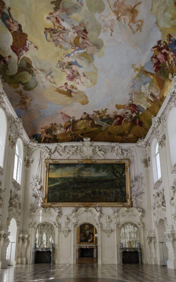 The great hall in the New Palace is decorated with impressive Baroque stucco work. This two-story-high room has a ceiling fresco depicting Trojan hero Aeneas fighting Turnus for Lavinia’s hand. This fresco was once the world’s largest ceiling fresco. (<a href="https://www.shutterstock.com/g/AESphoto">Andrey Shcherbukhi</a>/<a style="font-size: 16px;" href="https://www.shutterstock.com/image-photo/munich-munchen-germany-05-may-2016-449730193">Shutterstock</a><span style="font-size: 16px;">)</span>