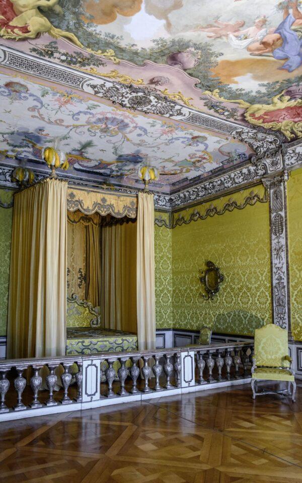 The apartment of the electress was designed by Joseph Effner. In contrast with gold in other rooms in the New Palace, the ornamentation here is silvered. The room’s yellow wall coverings and blue-gray panels complement the silver motif. (<a href="https://www.shutterstock.com/g/AESphoto">Andrey Shcherbukhi</a>n/<a style="font-size: 16px;" href="https://www.shutterstock.com/image-photo/munich-germany-05-may-2016-luxury-449730115">Shutterstock</a><span style="font-size: 16px;">)</span>