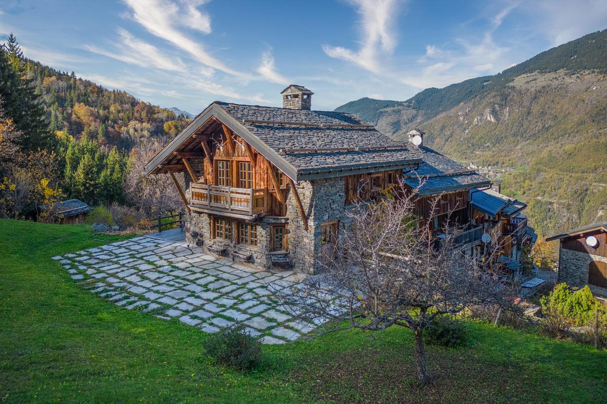 The traditional design showcases the skills of local artisans working with stone and lumber, in the form of this impressive residence in a majestic setting. (Courtesy of Sotheby’s Concierge Auctions)